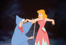 Cinderella is measured for a ballgown by her Fairy Godmother in a scene from Disney's Cinderella.