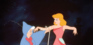Cinderella is measured for a ballgown by her Fairy Godmother in a scene from Disney's Cinderella.