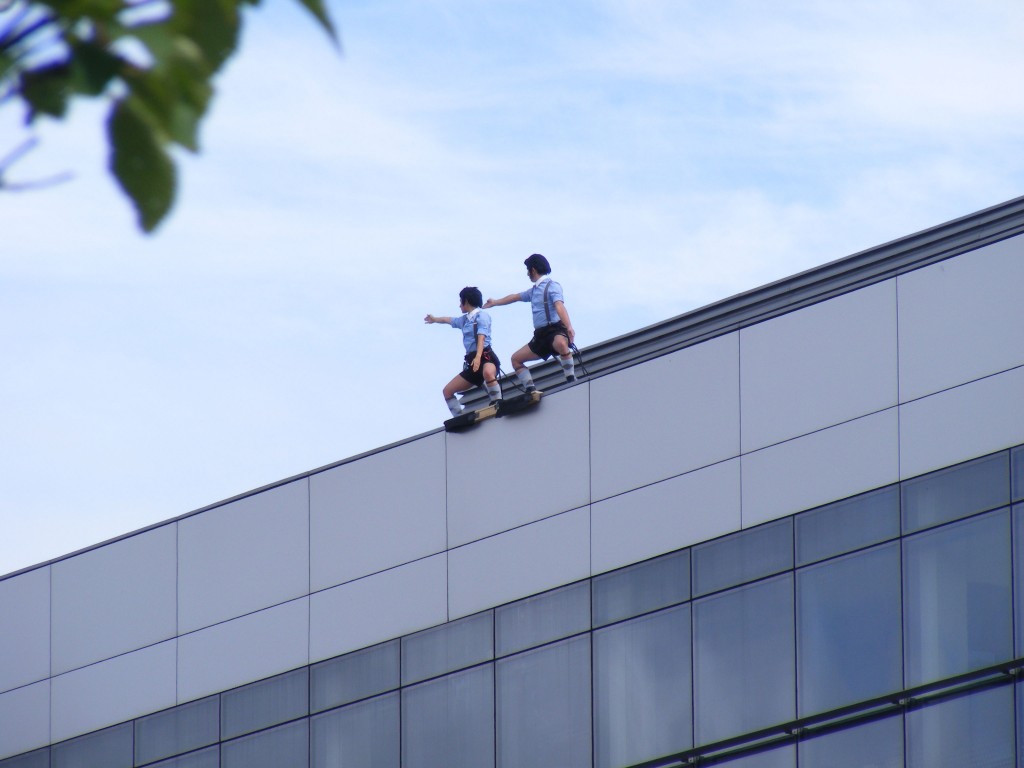 Spanish dance company Delreves, performing the opening moves of their Alice in Wonderland Inspired routine: 'Repite Conmigo' begin their dance at the top of the Menapia Building.